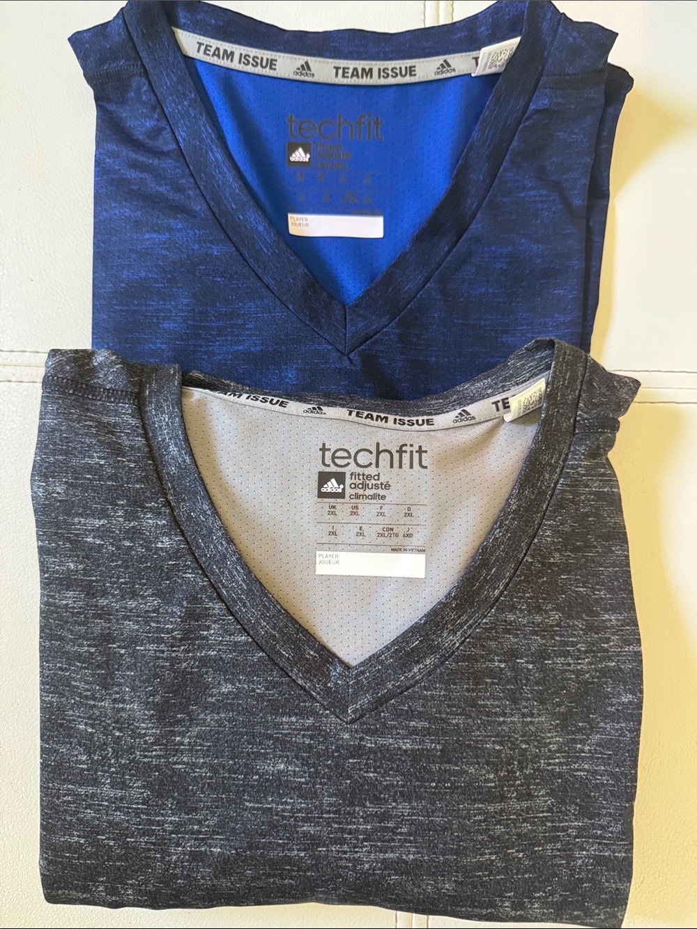 Two Adidas Techfit V-Neck Long Sleeve Tees in Blue and Charcoal